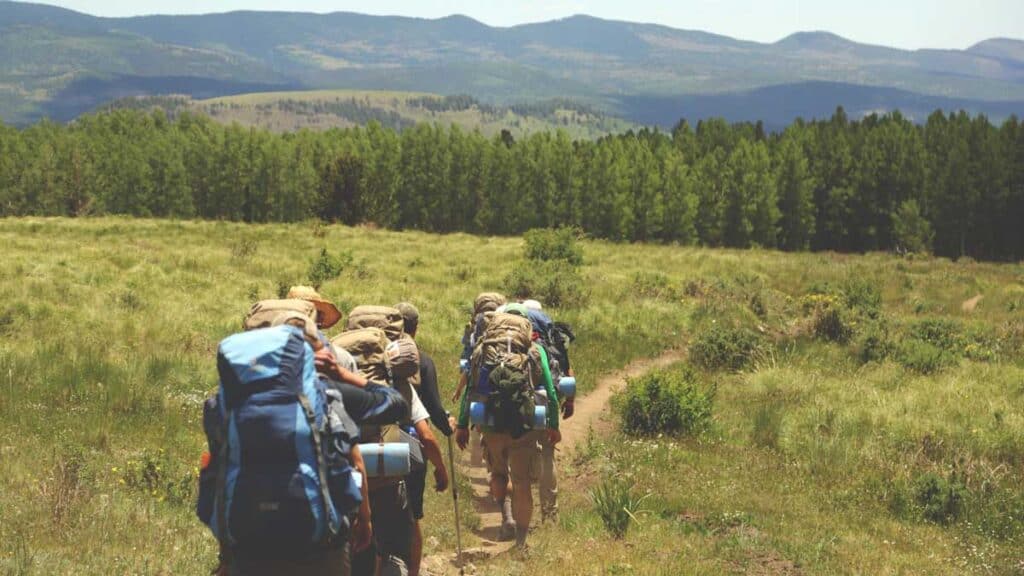 Hikers following a dirt road